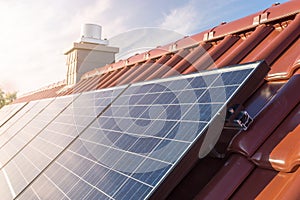 Solar panels or photovoltaic plant on the roof of a house