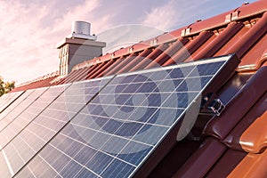 Solar panels or photovoltaic plant on the roof of a house photo