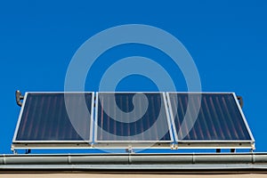 Solar panels or photovoltaic or solar thermal plant on the roof of a house