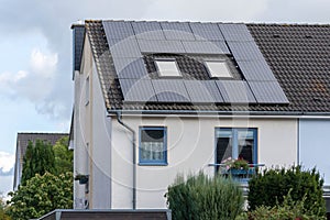 Solar panels of a photovoltaic power plant at the roof of a building
