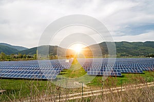 Solar panels, photovoltaics, alternative electricity source. View of a solar station at the foothills of a mountain
