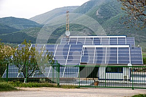 Solar panels, photovoltaics over the roof of an industrial building - alternative electricity source.