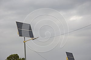 Solar panels in public park backgound. Photovoltaic modules for renewable energy, system of electric generators from the sun