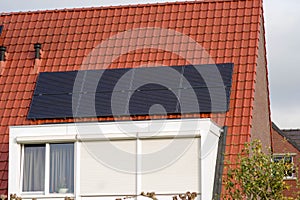 Solar panels on a red roof