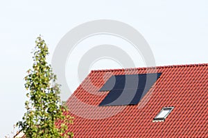 Solar panels on a red roof