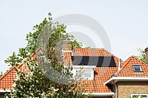 Solar panels on a red roof