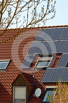 Solar Panels On A Red Roof