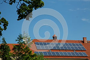 Solar panels on the red roof of the house