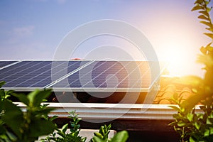 Solar panels on the red roof in a sunny and cloudy day. Photovoltaic instalation image