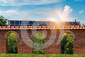 Solar panels on a red tiled roof - photovoltaic power plant