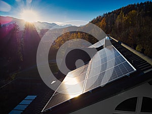 Solar Panels on Residential Roof: Evening Glow with Autumnal Backdrop