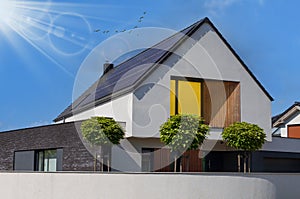 Modern house with solar panels and pool. Clear sky and ray sun photo