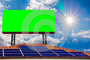 Solar panels on roof energy is renewable electrical and Green blank billboard with empty screen on beautiful cloudscape with