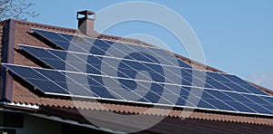 Solar panels on the roof of a house on a sunny day