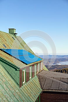 Solar panels on an a roof of an old mountain shelter