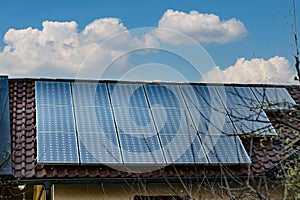 Solar panels on the roof of a private house. The concept of free solar electricity