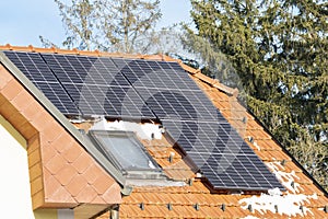 Solar panels on the roof in winter. High performance and ability to operate at low temperatures, reliable source