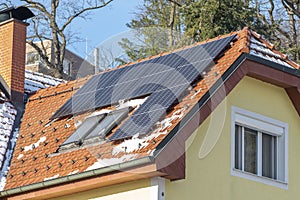 Solar panels on the roof in winter. High performance and ability to operate at low temperatures, reliable source