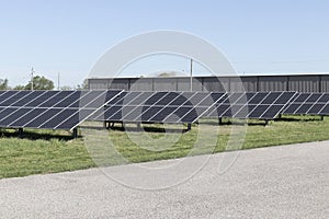 Solar panels and solar electricity farm. Many companies are converting unused land into solar farms to reduce CO2 gases