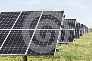 Solar panels and solar electricity farm. Many companies are converting unused land into solar farms to reduce CO2 gases