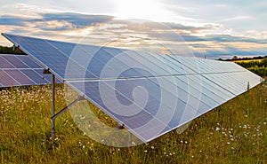 Solar panels at sunset. Renewable energy.