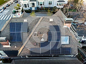 Solar panels system on the house roof in the city. Technology for alternative energy concept