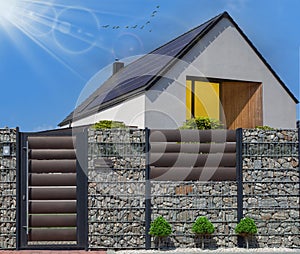 Modern house with solar panels. Clear sky, sun photo