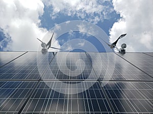 Solar panels, turbines, cameras, clouds photo
