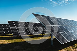 solar panels under blue sky, in new solar photovoltaic plant