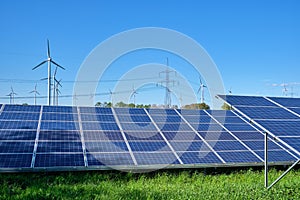 Solar panels, wind turbines and electricity pylons