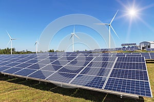 Solar panels and wind turbines generating electricity in hybrid power plant systems station