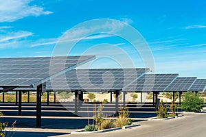 Solar pannels in rows in a parking lot or car park used as covering in the sweltering sun in Arizona