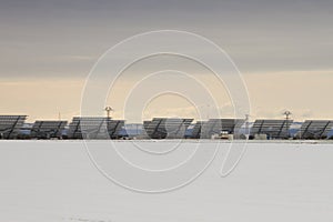 Solar pannels in snowy landscape photo