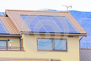 Solar power panels on the roof , Photovoltaic modules for innovation green energy for life