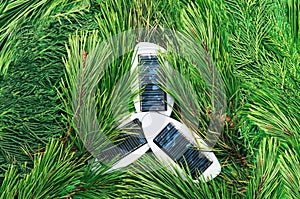 Solar power and renewable green energy inspired concept. Small portable solar panels surrounded with pine trees all over