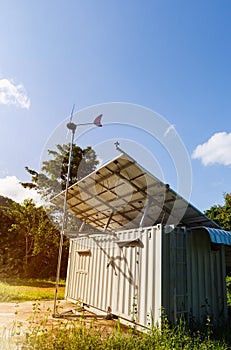 Solar power and wind turbine generator. Green energy concept.