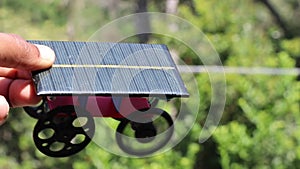 solar powered car using 3d printed parts for the body, wheels and basic electronic materials like dc motor and solar panel