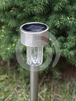Solar-powered garden lamp photo