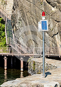 Solar powered lighthouse in the harbour