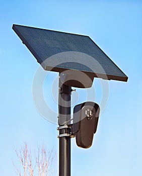 Solar powered security camera watching the community