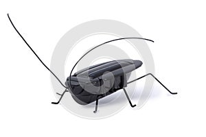 Solar powered toy grasshopper isolated