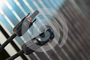 Solar PV Connectors of solar photo voltaic panel system. MC4 socket connector of solar cell panel. Electrical cables inside solar