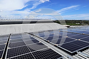 Solar PV Rooftop on Curve Roof under Construction Blue Sky Background
