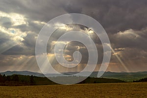 Solar rays and cloudy weather.