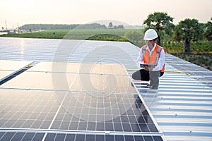 The solar rooftop(solar panel) with engineers check the operation of the system.