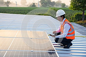 The solar rooftop(solar panel) with engineers check the operation of the system.