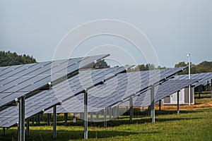 Solar system panels in the large photovoltaic power plant in the green field