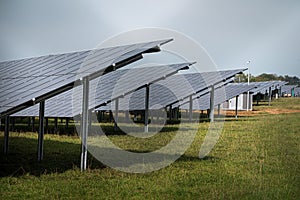 Solar system panels in the large photovoltaic power plant in the green field