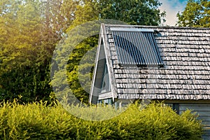 solar water heater on the house roof. evacuated tube collector photo