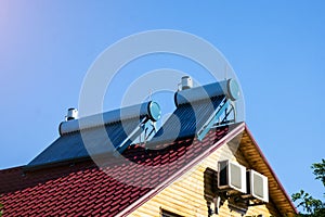 Solar water heaters on the roof close-up photo